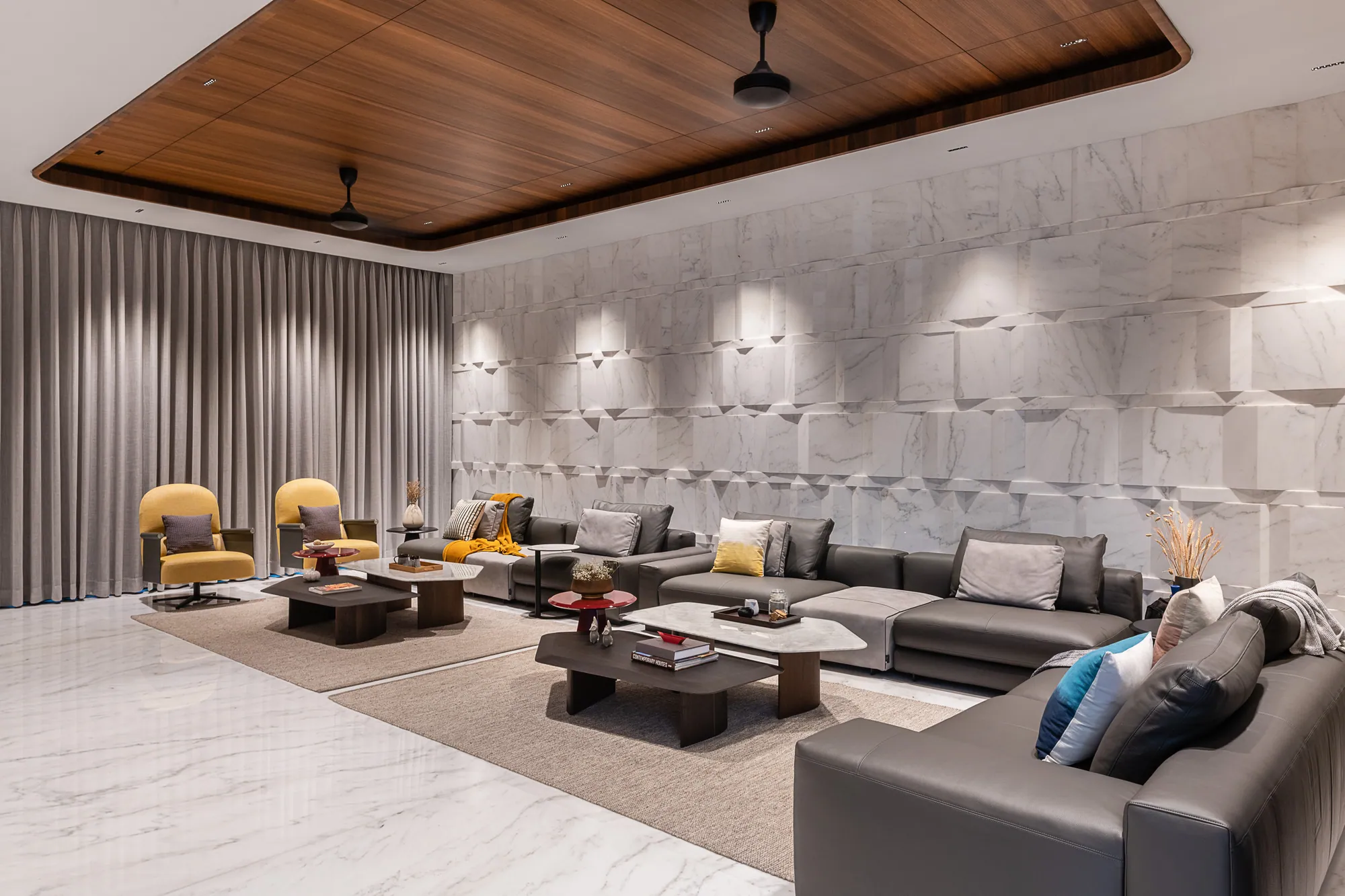 Living room with a timber ceiling and stone feature wall